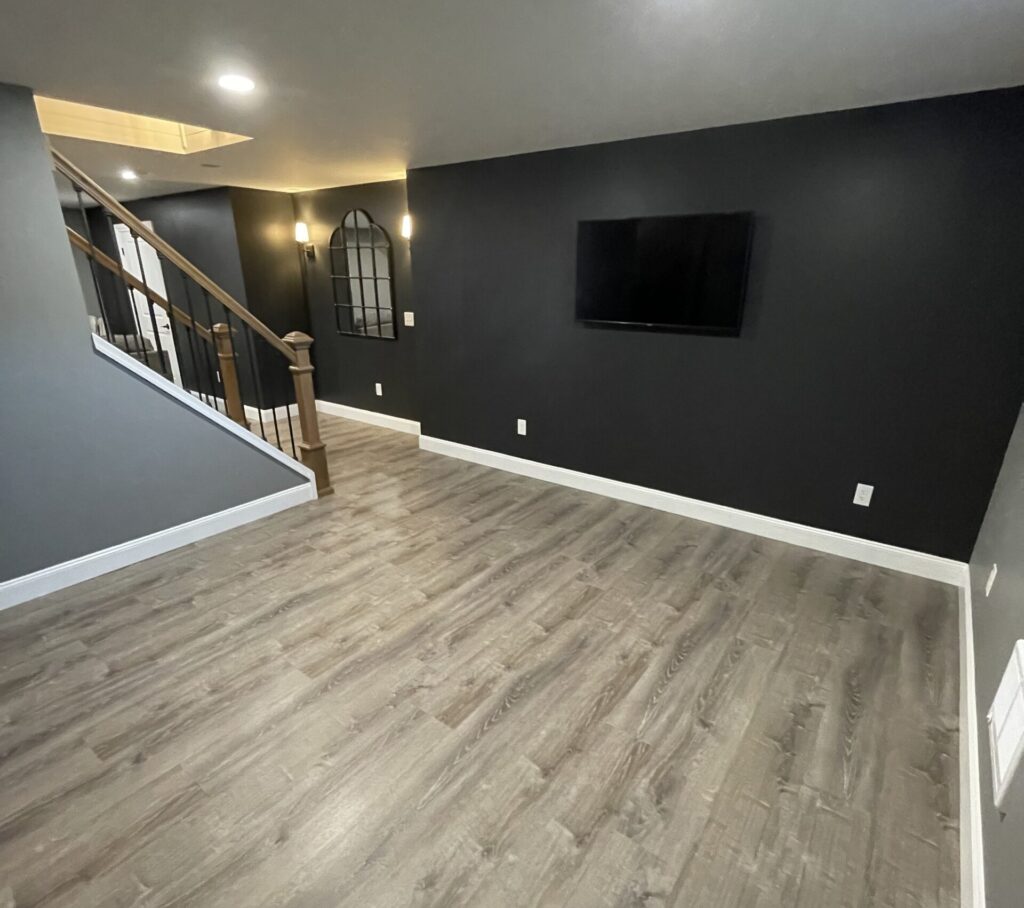 Empty remodeled basement by Sussick Construction.